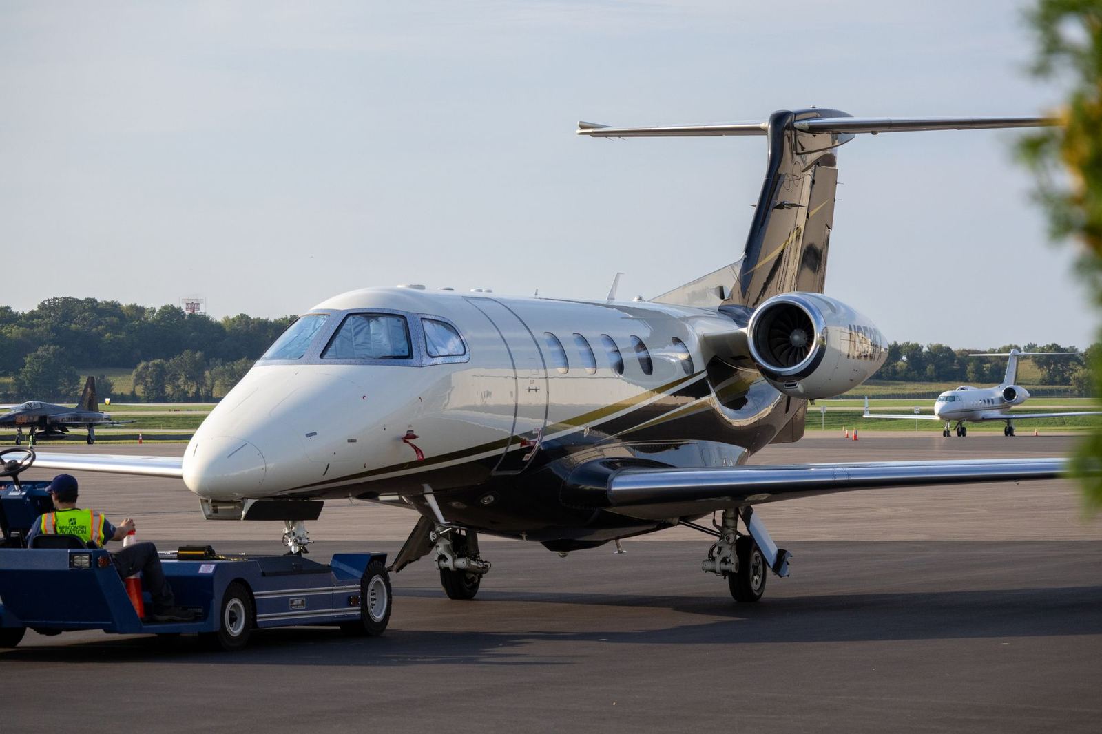 A business jet on the apron with its stairs down